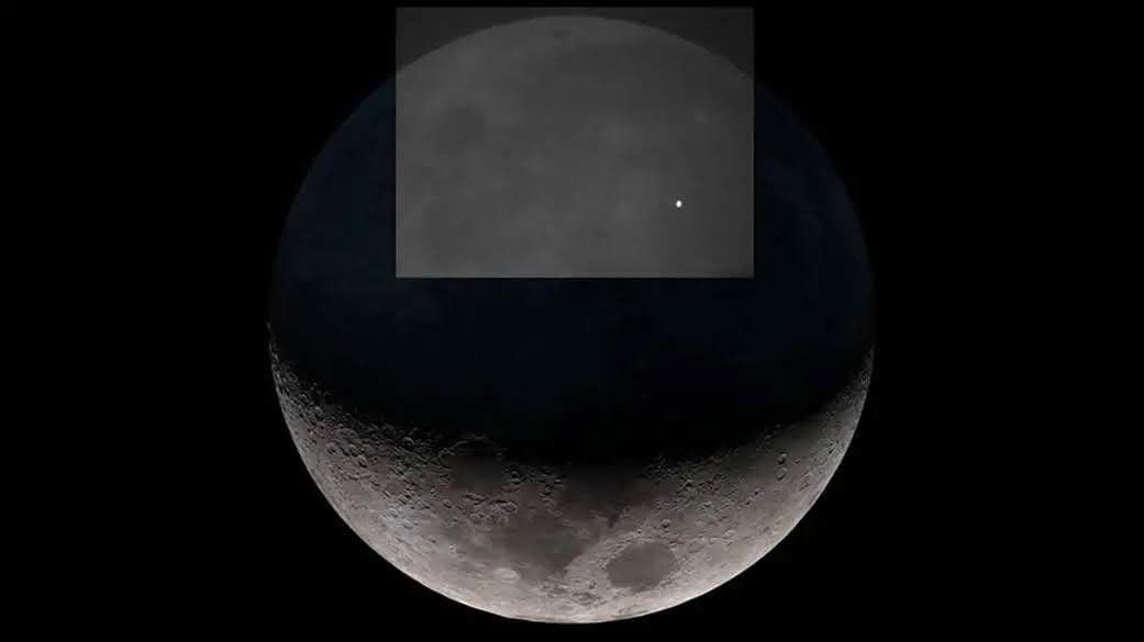 A photo of the moon with a box highlighting a white pin-prick of light.